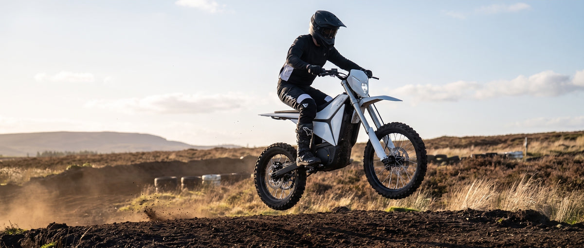 Electric motocross bike jumping on the moor